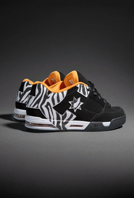 GIF of DC sneakers displayed on textured concrete blocks against a gray background.