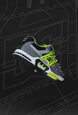 Gray and green sneaker on a black background with abstract patterns