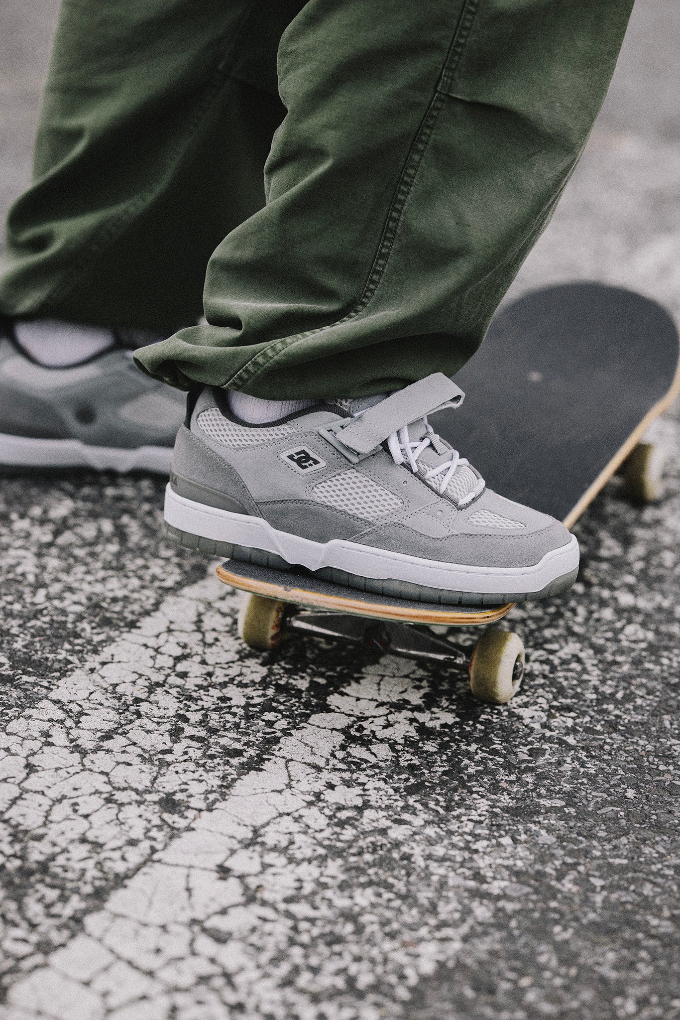 JS1 Shanahan shoes in grey worn by somebody riding a skateboard