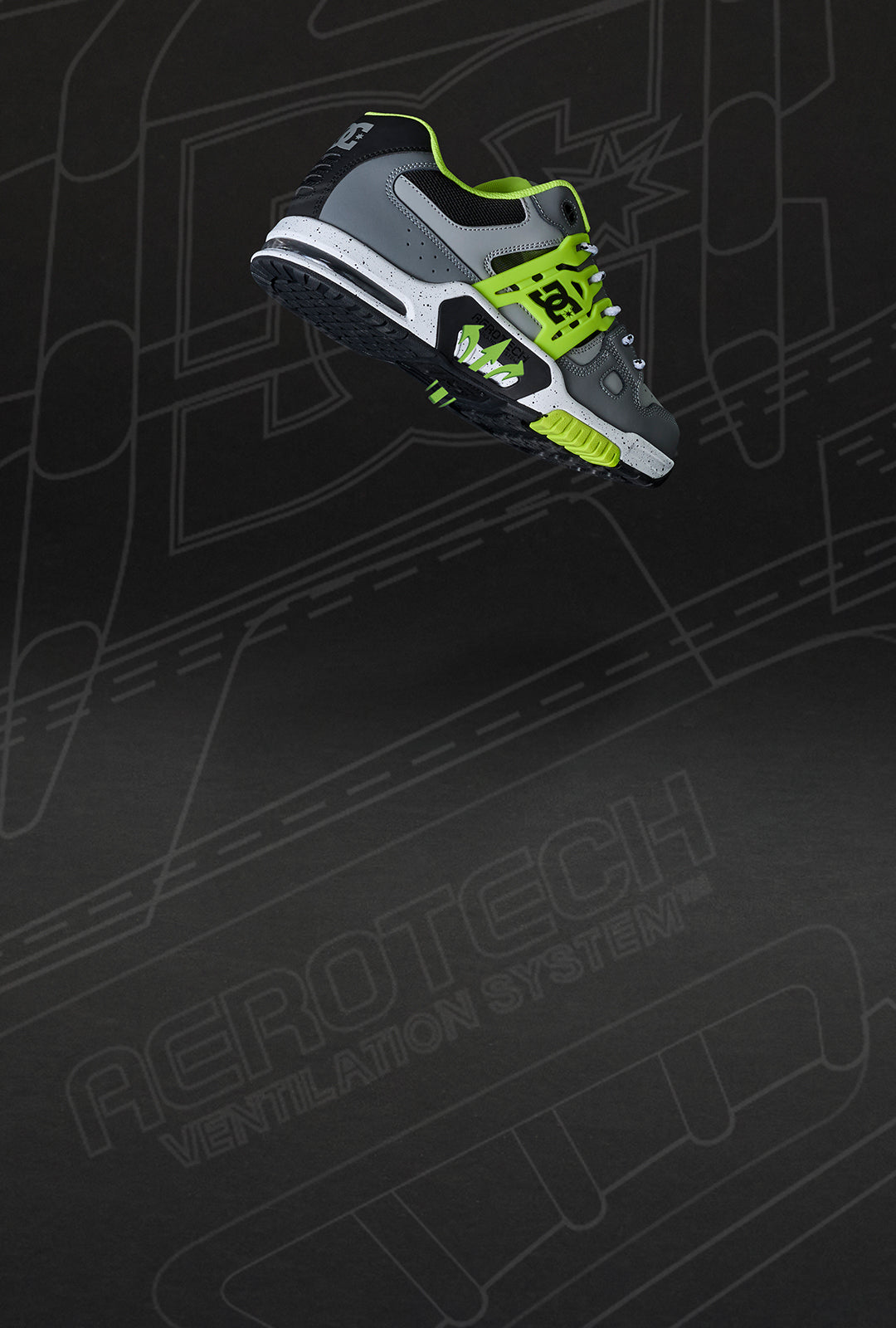 Gray and green sneaker on a black background with abstract designs