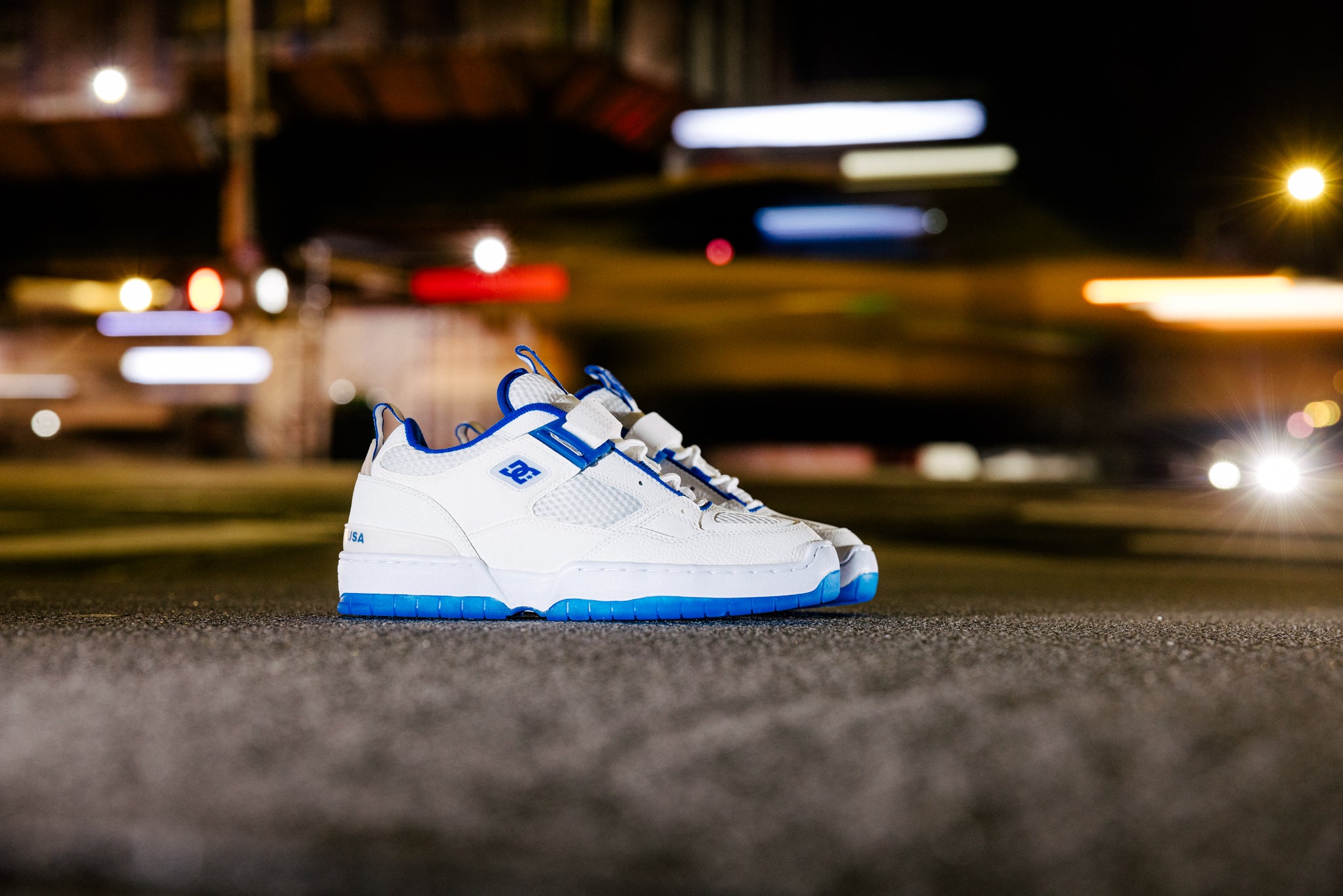 Shanahan shoes in white and blue with a city backdrop