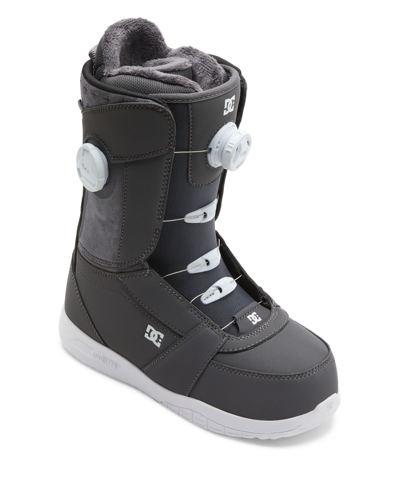 The DC Shoes Lotus is a single dark gray snowboarding boot with white laces, a plush gray interior, and two white tightening dials on the side, shown on a white background.