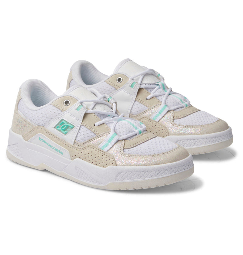 The Women's Construct Shoes by DC Shoes feature a stylish leather upper in white and beige with light blue accents, perforated sides, mesh panels, and cushioned soles, shown on a white background.