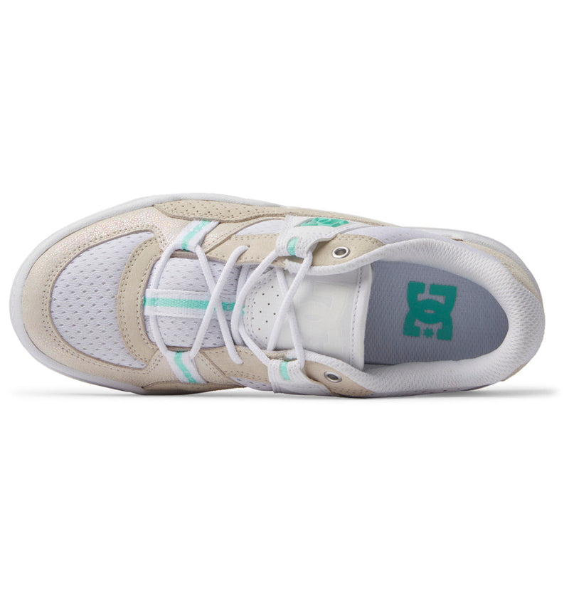 Top view of Women's Construct Shoes by DC Shoes featuring a white and beige leather upper, teal accents, perforated toe box, teal “DC” logo on the insole, and white laces—showcasing signature DC Shoes style.