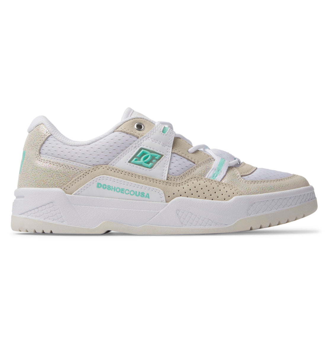 The Women's Construct Shoes by DC Shoes are low-top sneakers for women in white and beige with teal accents. They feature mesh, suede, and leather panels, perforated details, DCSHOECOUSA branding, and a textured off-white sole.