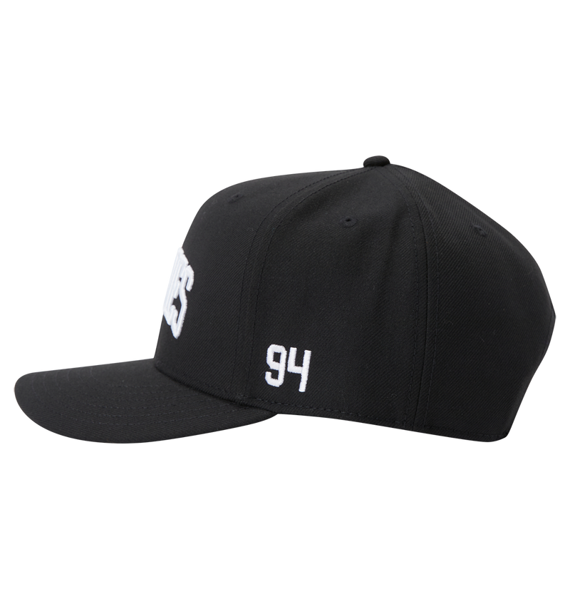 The DC Shoes Men's Semi-Pro Snapback is a black flat-brim hat with "94" embroidered in white on the side, partially visible white text on the front, and an adjustable fit for comfort. Shown from the left side.