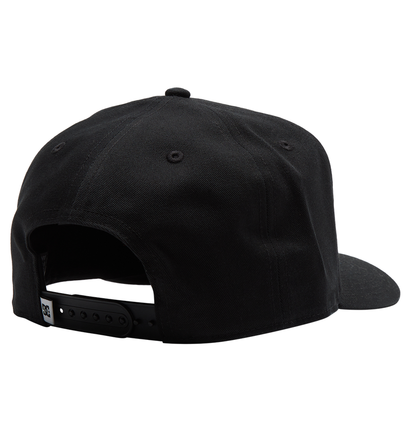 The Men's Reynotts Cap by DC Shoes is a black skate snapback, shown from the back with an adjustable plastic strap, a small white tag near the opening, and subtle DC branding for authenticity.
