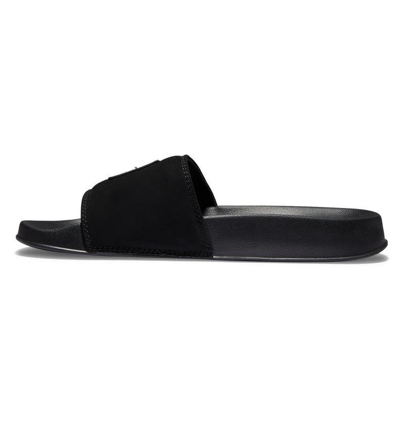 A side view of Men's DC Slides by DC Shoes in black, featuring a thick strap and flat sole for all-day comfort—ideal for your gym bag. Displayed on a white background.