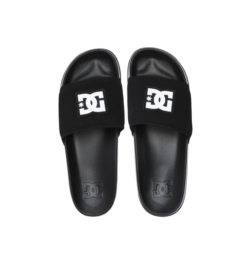The Men's DC Slides from DC Shoes feature black wide straps with the white DC logo—ideal for comfort on the go or easy to pack in your gym bag.