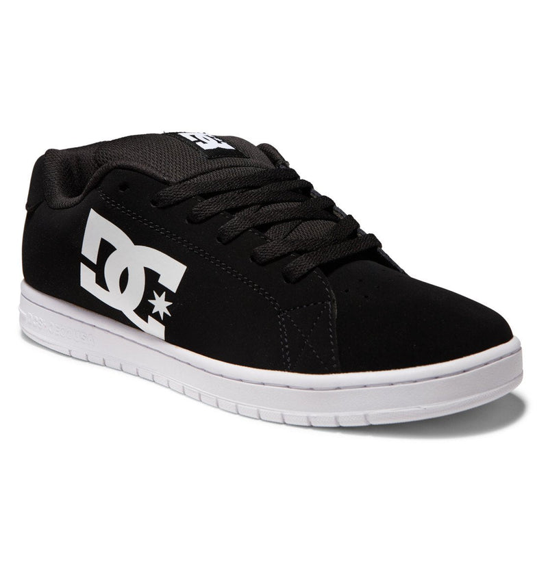 The Men's Gaveler Shoes by DC Shoes feature a black chunky leather upper, thick black laces, a white DC logo on the side, and a white rubber sole. Shown from a front-side angle.