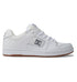 The DC Shoes Men’s Manteca 4 Shoes are white low-top sneakers featuring a gum sole, white laces, perforated detailing, and the DC Shoes logo in gray on the side. Designed as a versatile skate shoe, they combine classic style with modern performance features.
