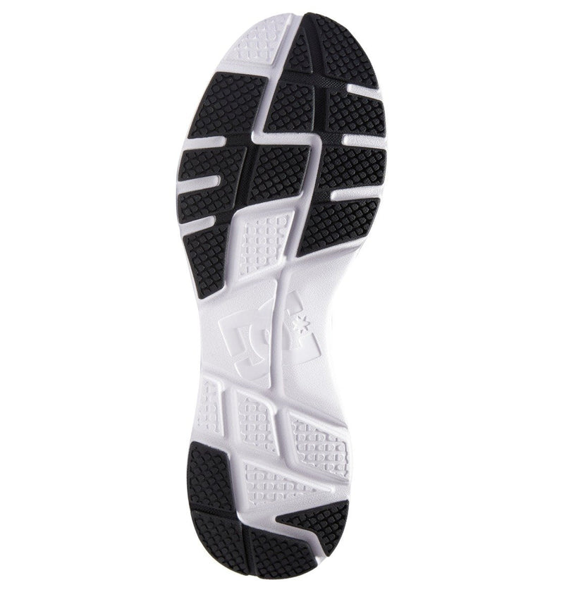 The image shows the black and white rubber sole of the Men's Skyline Lightweight Shoes by DC Shoes, featuring a geometric tread pattern with the DC Shoes logo embossed in the center.