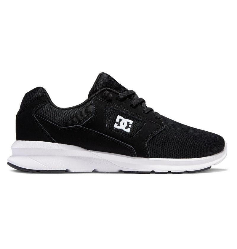 The DC Shoes Men's Skyline Lightweight Shoes are black street shoes with a white sole and the DC logo in white on the side, made from nubuck leather mesh, shown in a side view against a white background.