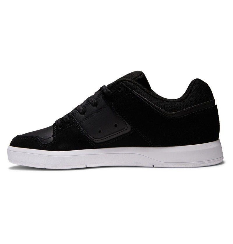 The Men's DC Cure Shoes by DC Shoes are shown in a side profile view, featuring a black low-top design with a white sole against a plain white background.
