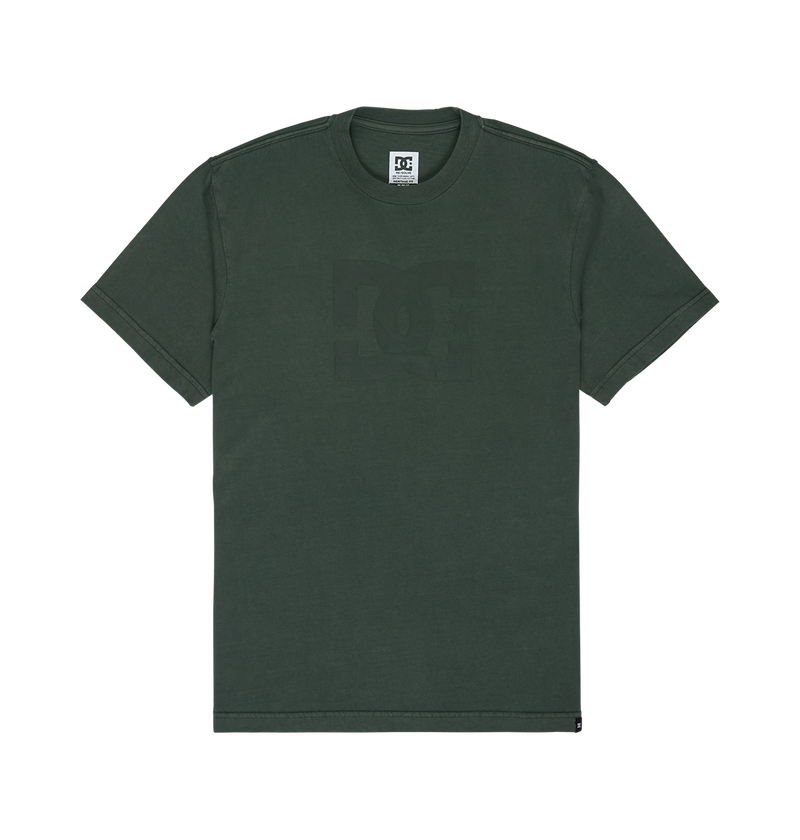 A dark green Men's DC Star Pigment Dye Tee by DC Shoes, featuring short sleeves, a subtle DC logo graphic on the chest, a DC tag on the collar, and relaxed fit styling, displayed on a plain white background.