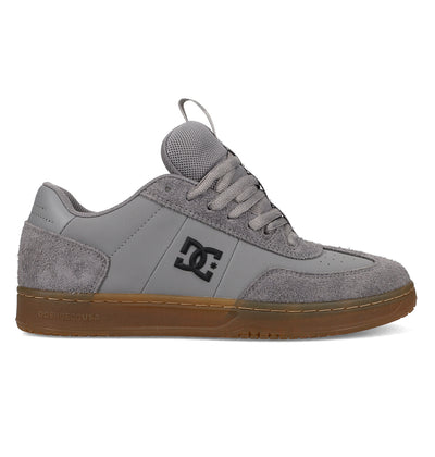 The Men's Astrix Shoes by DC Shoes feature gray suede and mesh panels, light gray laces, a black DC logo, and a brown rubber sole. Designed for street skating and excellent board control, they're shown in a side profile against a white background.