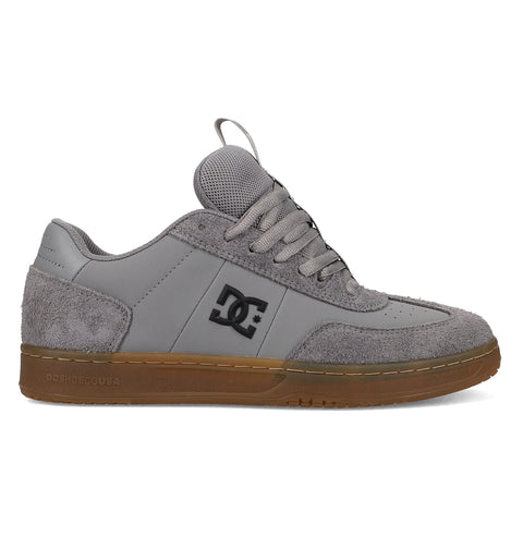 The Men's Astrix Shoes by DC Shoes feature gray suede and mesh panels, light gray laces, a black DC logo, and a brown rubber sole. Designed for street skating and excellent board control, they're shown in a side profile against a white background.