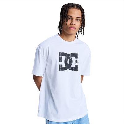 Man wearing a light blue DC Shoes t-shirt
