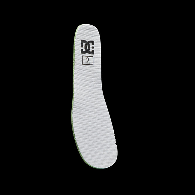 A white DC shoe insole with the logo and size 9 printed in black near the heel, displayed vertically on a solid black background.