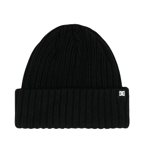 The Fish N Destroy Youth beanie by DC Shoes is a black ribbed knit hat featuring a folded brim and a small rectangular logo tag on the side. Made from comfortable knit fabric with recycled fibers, it is displayed against a plain white background.