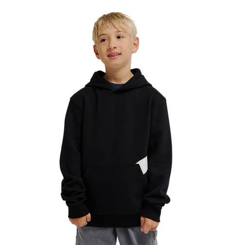 A young boy with short blond hair wears the DC Shoes Lanai Hoodie Youth pullover, featuring DC graphics, fleece warmth, and a front pocket. He pairs it with light pants and stands smiling against a plain white background.