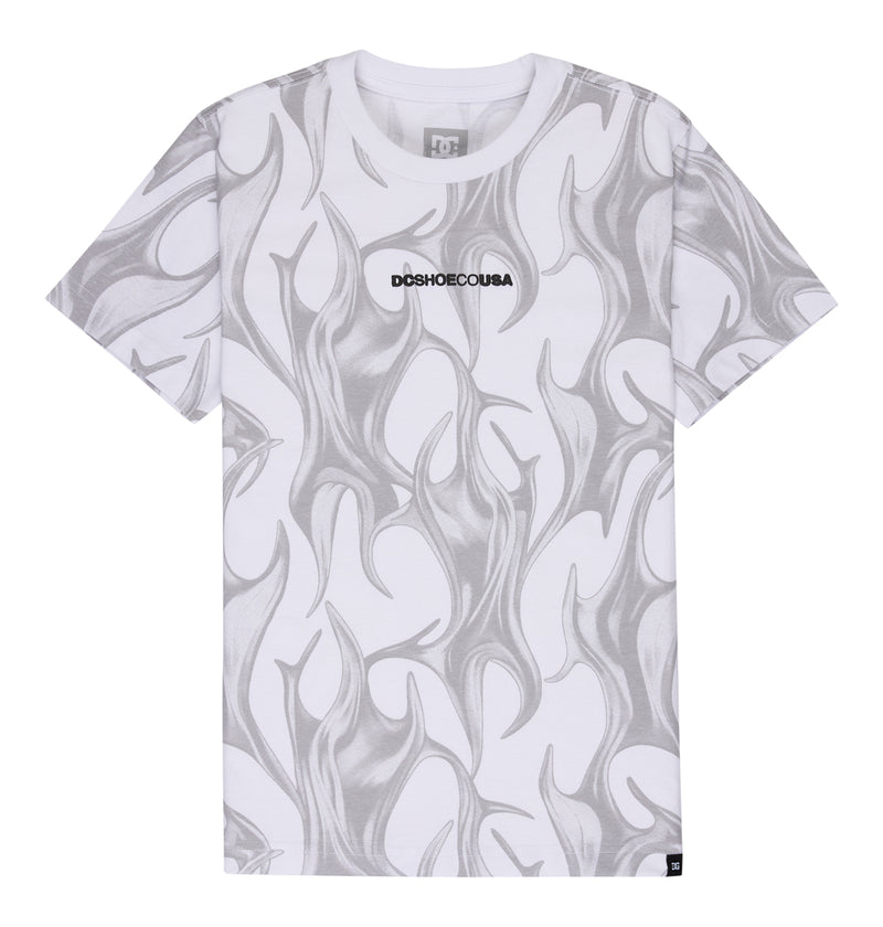 The Reebok DC Liquid Fuego Hss Youth is a white short-sleeve t-shirt featuring gray abstract flame patterns and "DCSHOECOUSA" in bold black text centered on the chest.