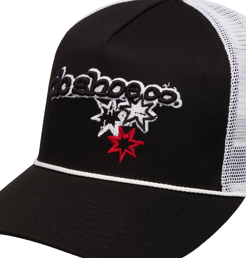 The Reebok Side Star Trucker is a black and white mesh trucker hat, featuring "dc shoeco." embroidered in black and white, plus two white stars and one red star stitched on the front.