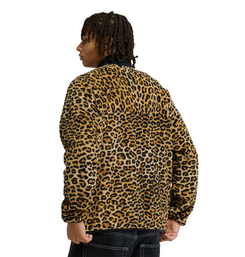 Person with short curly hair wearing the DC Shoes Lynx Fleece jacket in a fuzzy, leopard-print pattern, shown from the back against a white background—a perfect choice for cold-weather comfort.