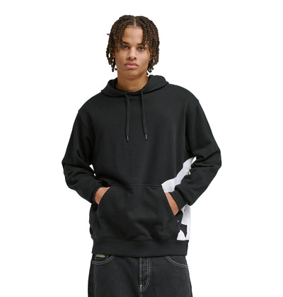 A young man with short, braided hair wears the DC Shoes Lanai Ph black hoodie with a front pocket and subtle white graphic on the side, standing with hands in the pocket and facing forward.