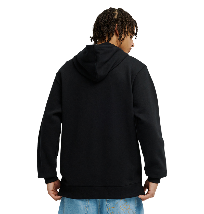A person with short, curly hair is seen from behind wearing the Men’s DC Strass Star Hoodie by DC Shoes—a black pullover featuring a rhinestone DC star—paired with light blue jeans, standing against a plain white background.