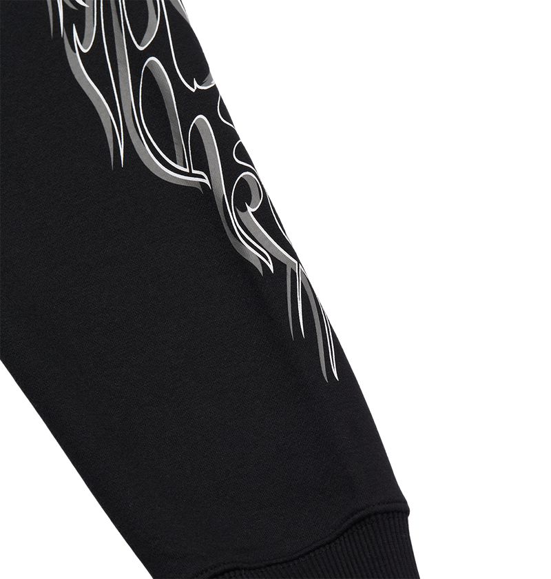 The Men's Side Flame Hoodie by DC Shoes features a black sleeve adorned with a white, abstract flame design near the upper part, evoking the brand's bold graphic style. Finished with a ribbed cuff for added detail and comfort, this hoodie stands out against its plain white background.