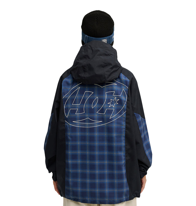 A person wears the DC Shoes Trackstar Jacket 10K—a dark hooded jacket with a blue plaid pattern and a large outlined logo on the back—offering breathable protection and excellent snow performance, standing against a white background.