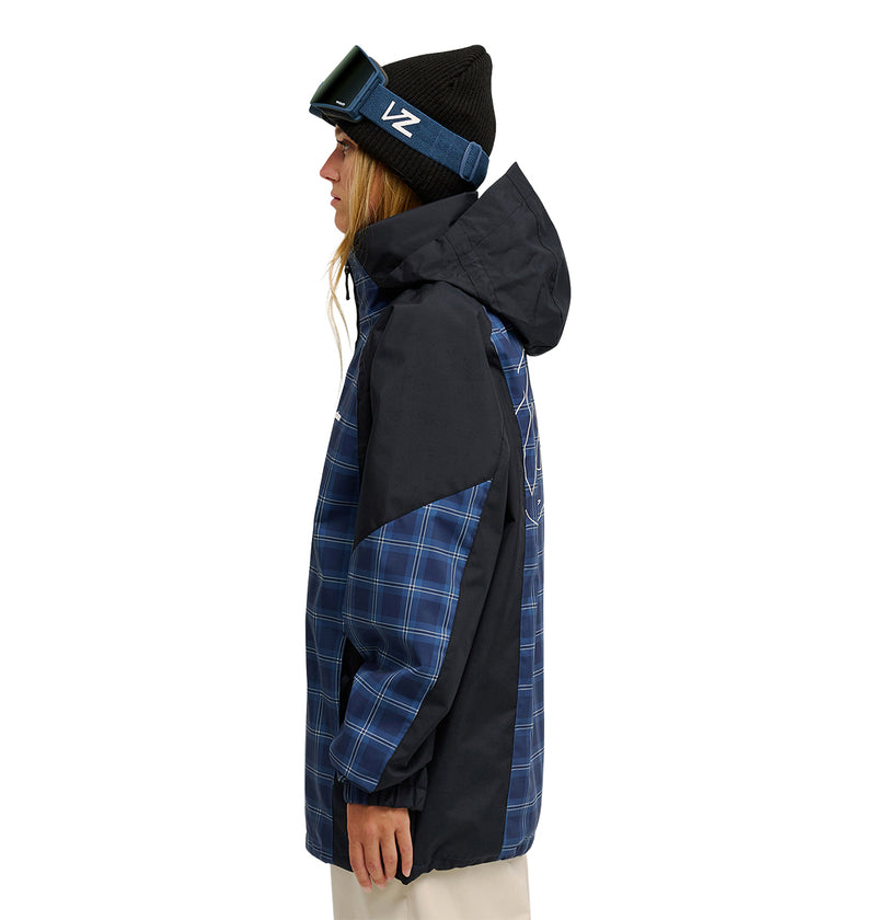 A person is shown from the side against a white background wearing the DC Shoes Trackstar Jacket 10K in blue plaid and black, which features breathable protection, paired with tan pants, a black beanie, and ski goggles.