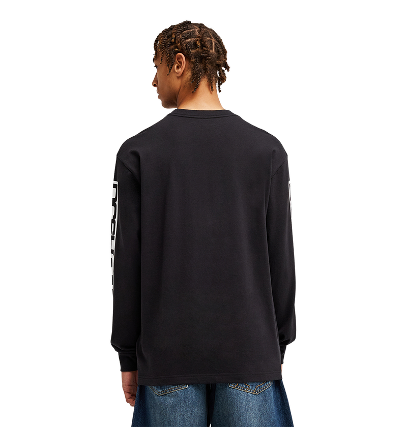 A person with short, braided hair is seen from behind against a plain light background, wearing the Men's DC Echo Tee by DC Shoes—a black graphic T-shirt with bold white sleeve text—paired with blue jeans, perfectly styled for laid-back skate sessions or casual hangouts.