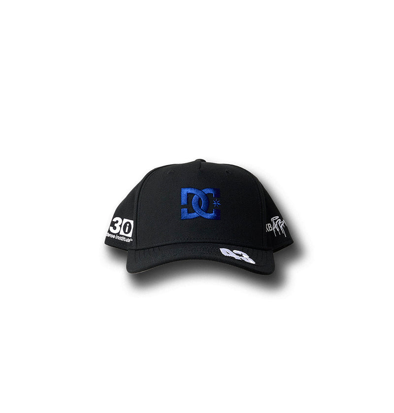 The KB 43 Snapback by DC Shoes features a blue embroidered DC logo on the front, the number 30 on the side, extra logos on the bill, and bold white artwork. Part of Ken’s Rally Teamworks Collection for a standout look.