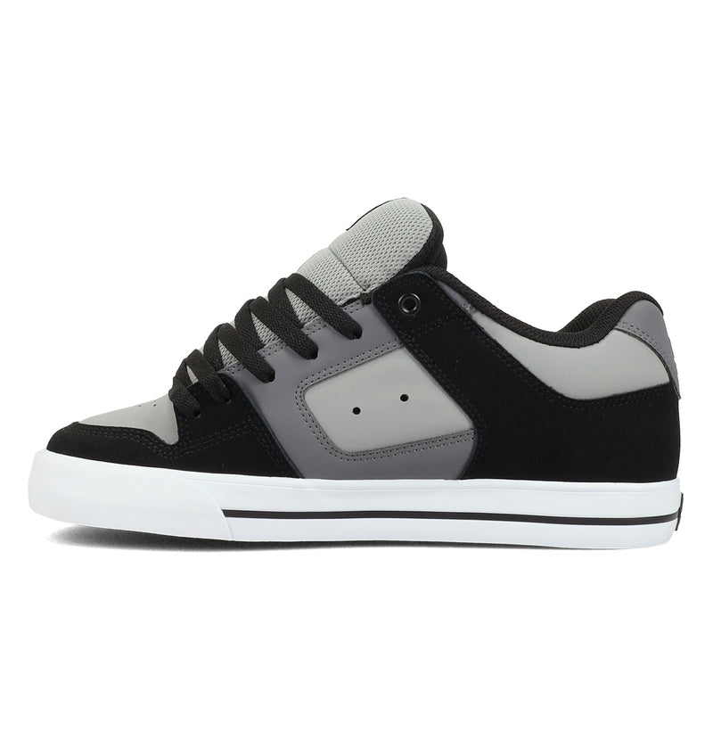 The DC Shoes Men's Pure Shoes feature a black, gray, and white low-top design with a white midsole, black laces, and gray mesh tongue—stylish and comfortable men's sneakers shown from the side against a white background.