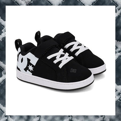 Black and white sneakers with a prominent logo on a marble background