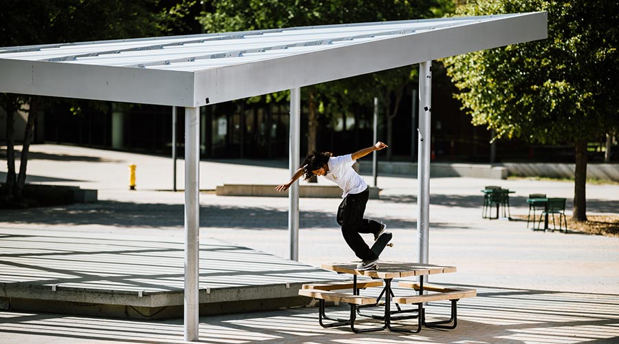A man skateboarding at a park