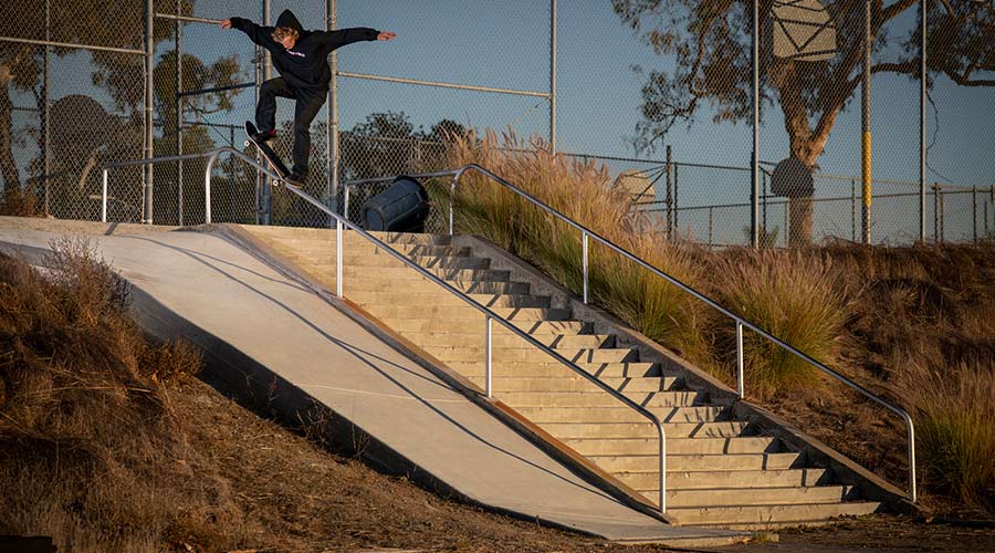 Man performing a skateboard trick on a flight of stairs
