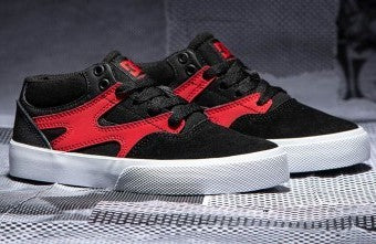 Black and red and white skate shoes with a white out sole