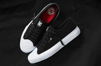 Suede skate shoes in black and white and a red inner sole
