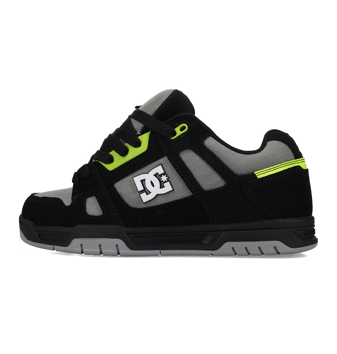 Black sneaker with green accents and a visible brand logo on a white background