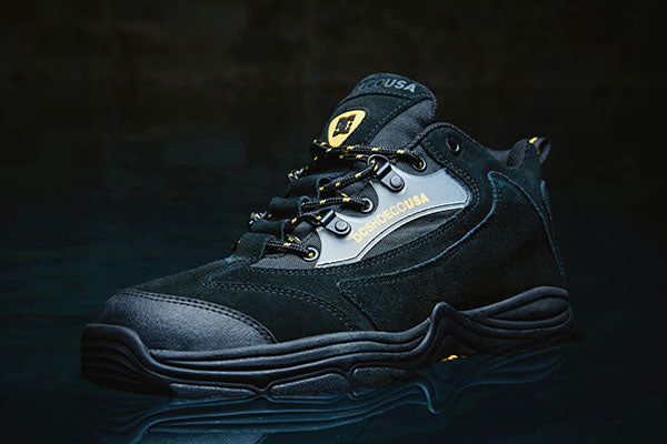 Black hiking boot with visible brand name on a dark background