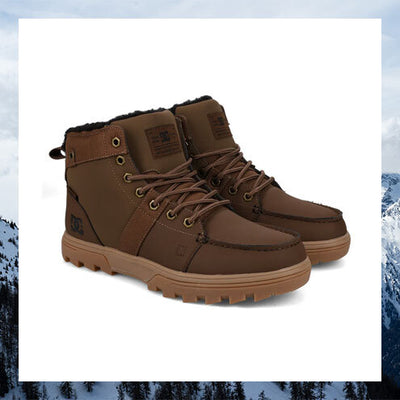 Pair of brown winter boots with fur lining on a white background