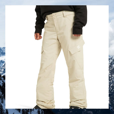 Beige snow pants worn by a person with a snowy mountain background